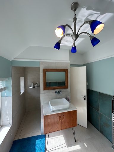 a completely new bathroom in Stratford upon Avon with beautiful 600x600mm tiles